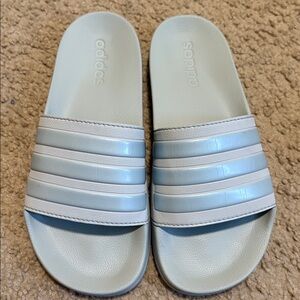 Light blue adidas slides